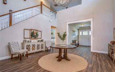 Soaring ceilings with crown molding and wood-look tile floors are just the beginning!