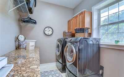 This laundry room features plenty of countertop space!