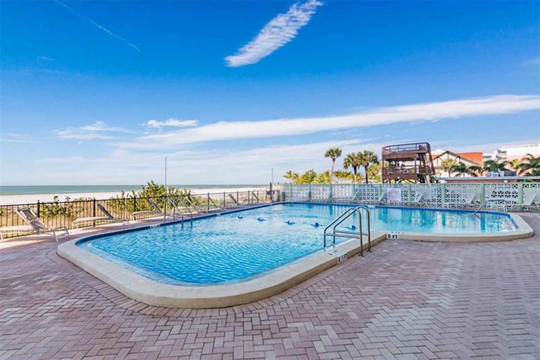 Relax by the beautiful pool or on the expansive beach on the Gulf