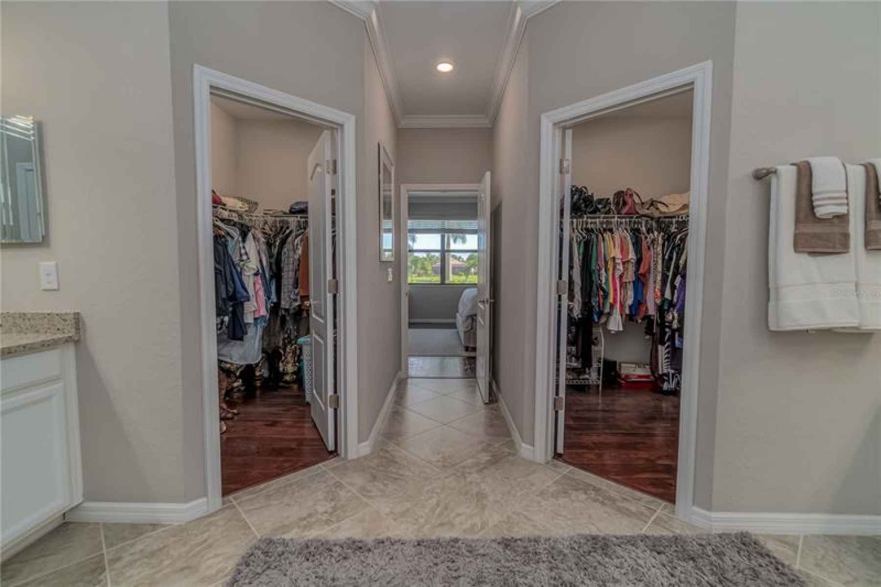 HIS AND HERS MASTER CLOSETS