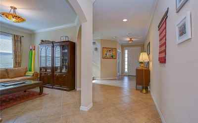 Step inside and be welcomed into the grand foyer with beautiful tile floors set on the diagonal!