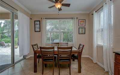 An open dining area is adjacent to the kitchen with sliders to the Oasis that awaits you outside!