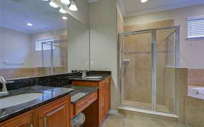 Dual sinks featuring a walk-in shower!