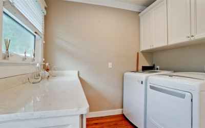 Open laundry room at end of kitchen. Convenience!