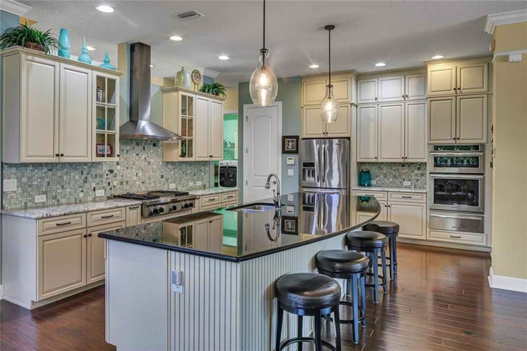 Gourmet kitchen with custom cabinets, granite countertops and Kitchen Aid Stainless Steel Appliances
