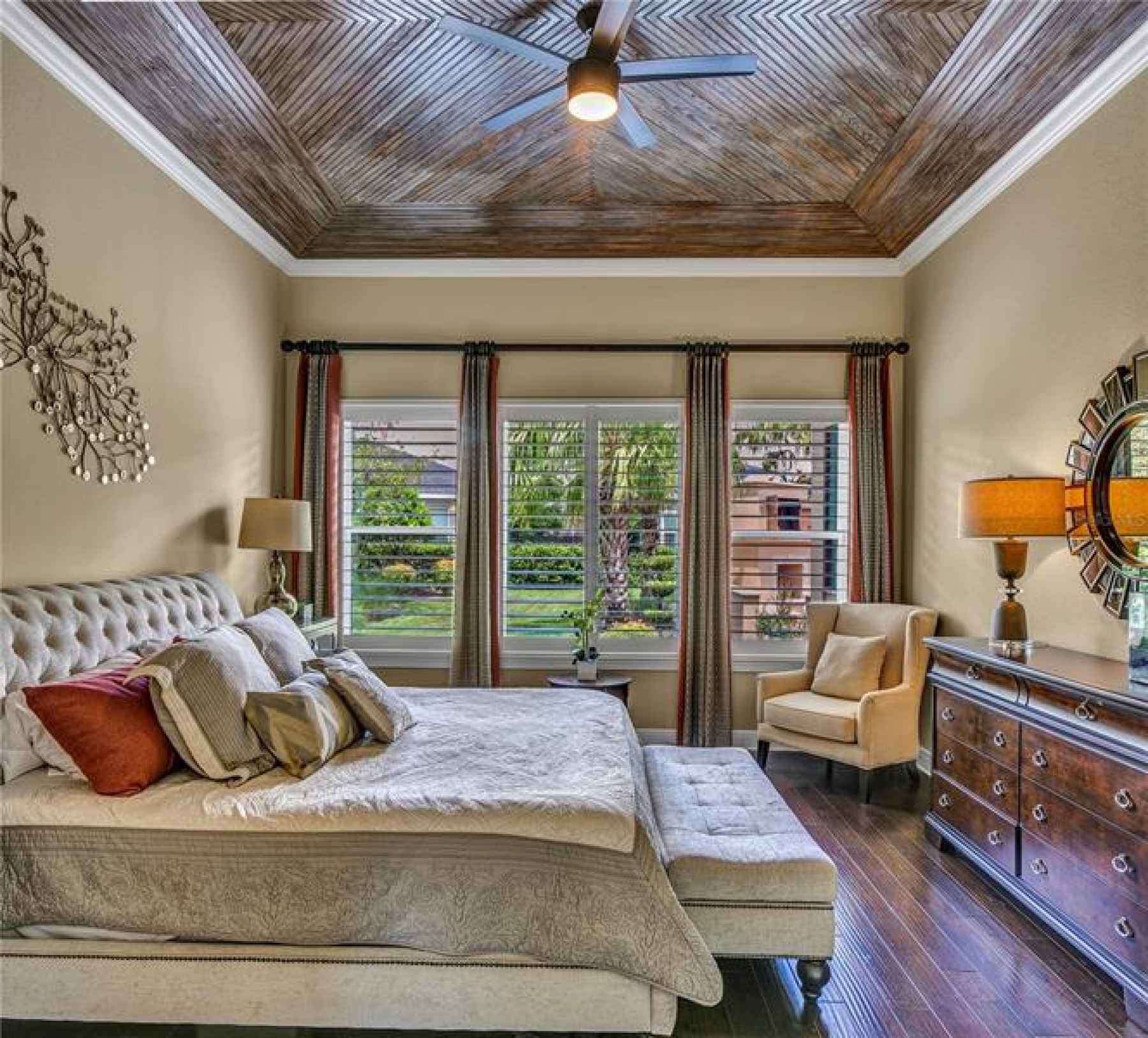 Owners Retreat with crown molding, wood tray ceilings and custom blinds