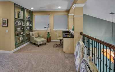 Study with built in book shelf and desk. Overlooking the Breakfast Nook and Family Room.