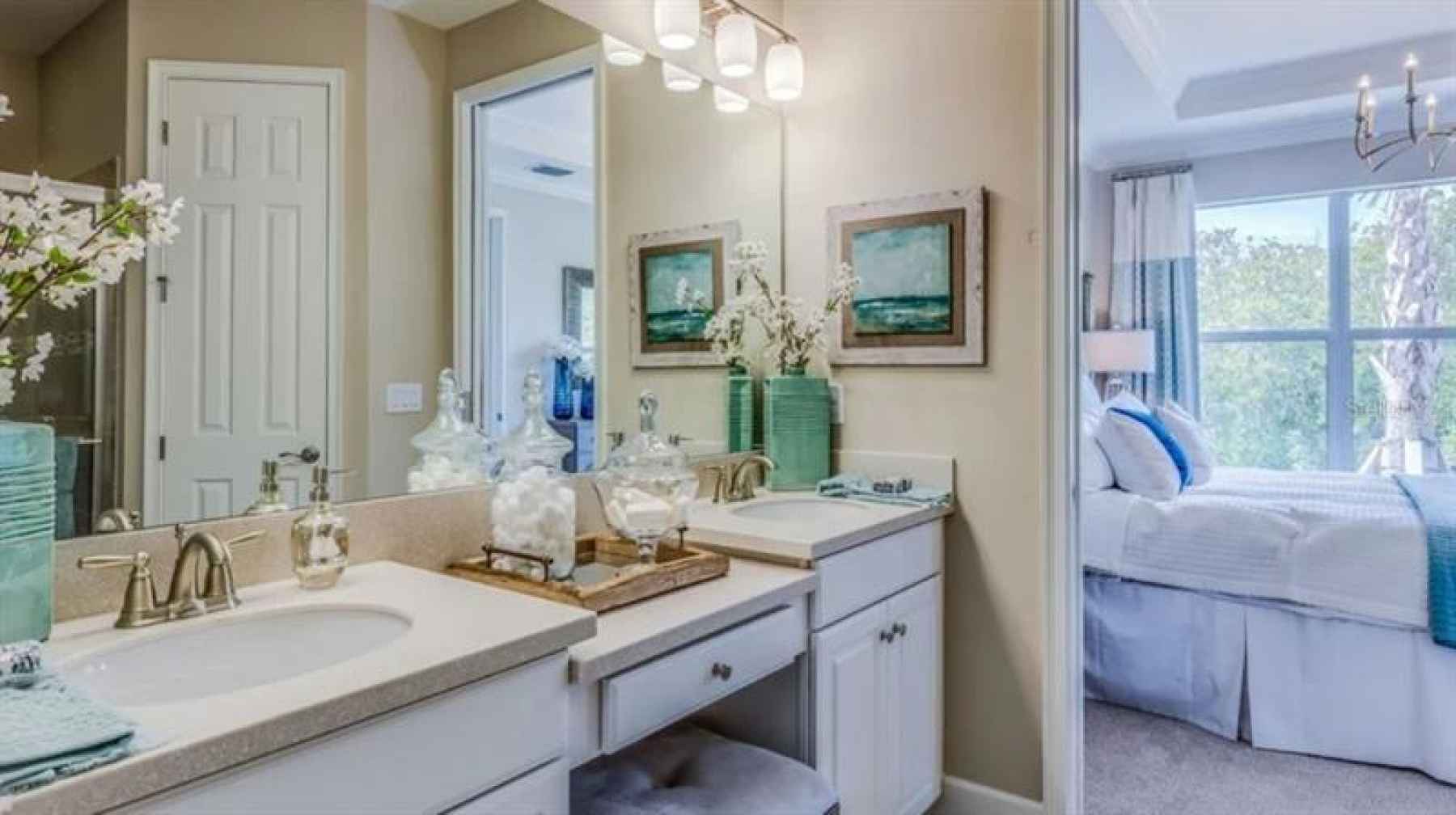 * REPRESENTATIVE PHOTO. The owner???s suite bathroom features dual sinks, extra cabinet space and pl