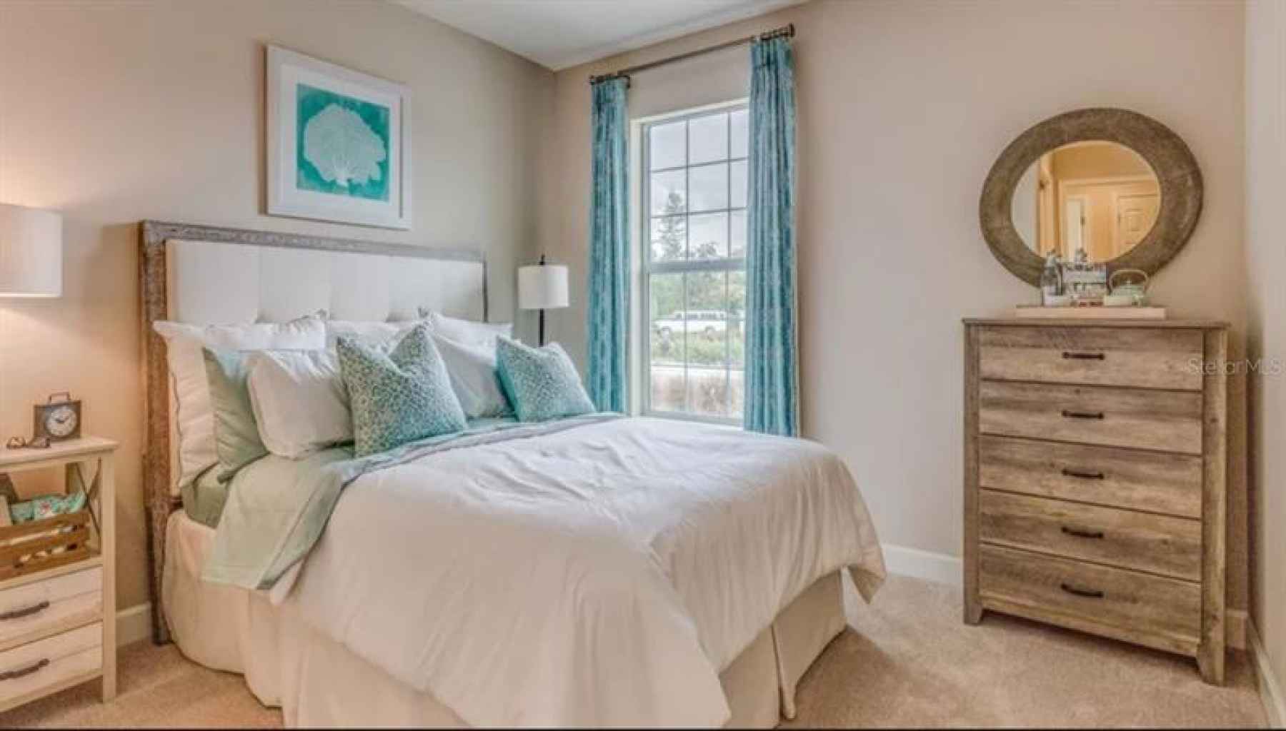 * REPRESENTATIVE PHOTO. Plush carpet and natural light adorn this well-designed secondary bedroom.