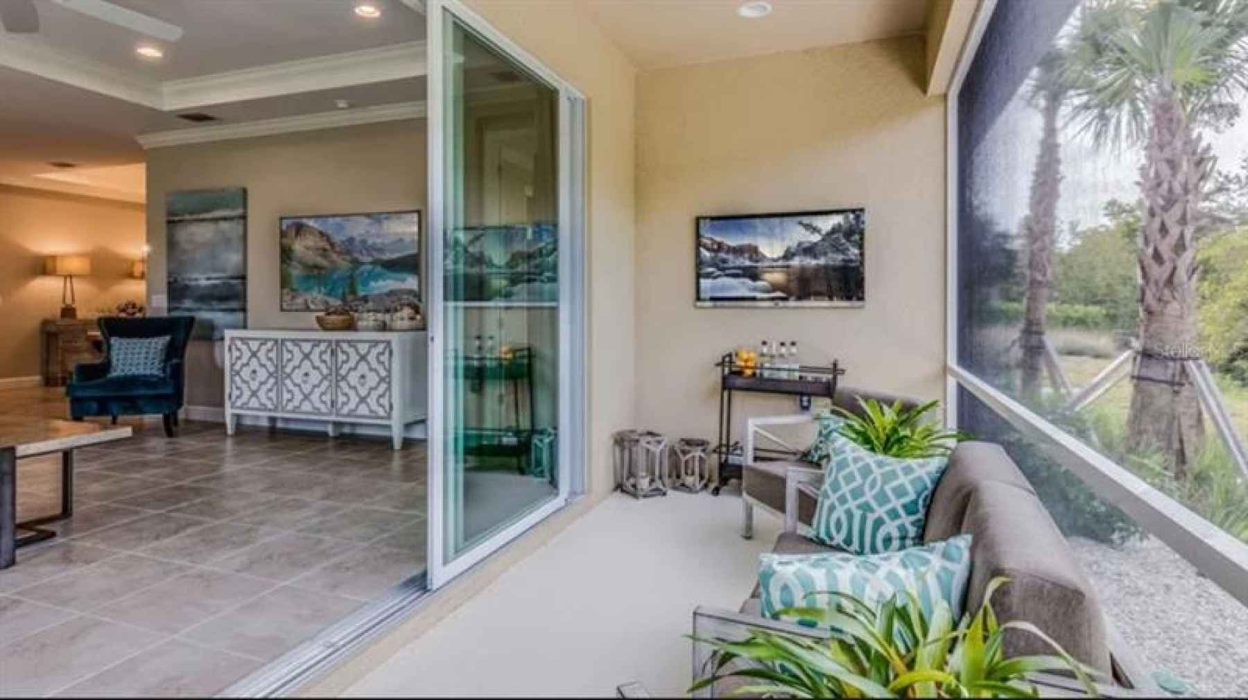 * REPRESENTATIVE PHOTO. Covered Lanai with extended screened in patio!