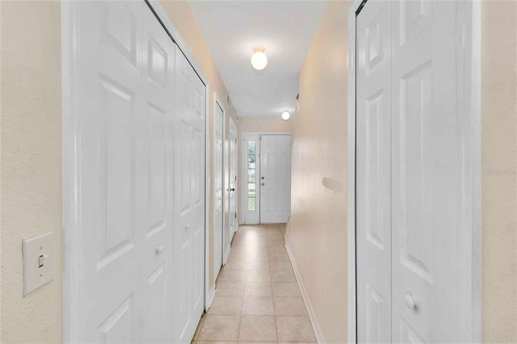 Half-bath, laundry and storage closet make this entryway ideal.