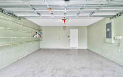 Garage's Epoxy floors and shelving make it ideal for projects and storage.