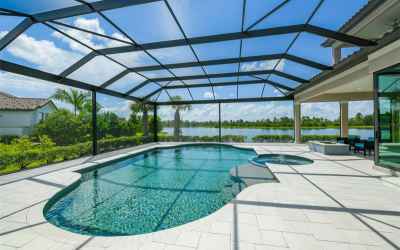 Heated pool & spa with sun shelf with panoramic screens for open lake views