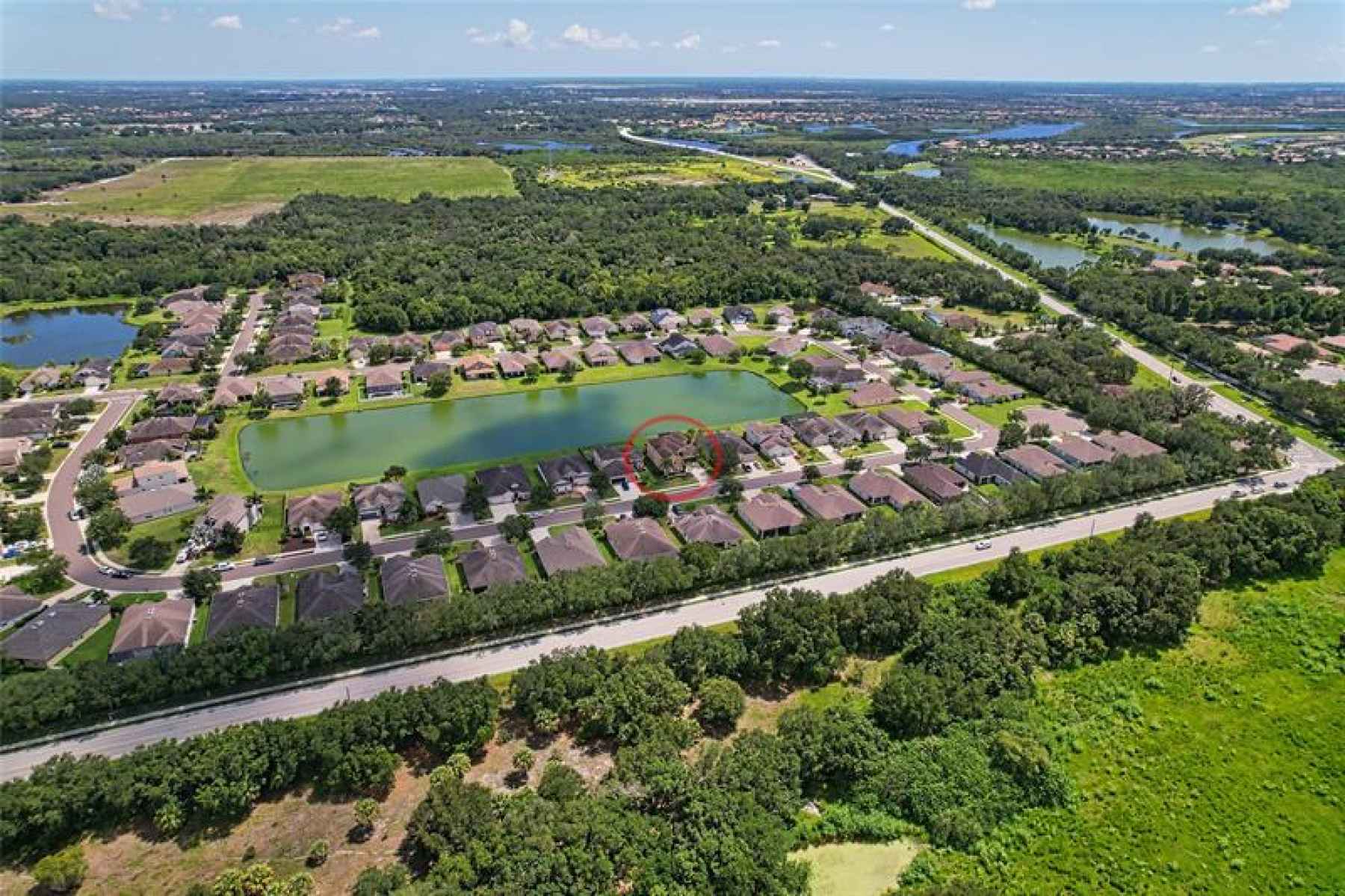 Aerial View of Home, Lake, and Manatee River in the background.