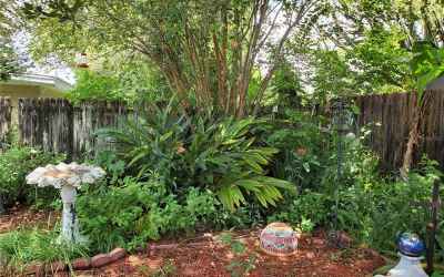 Rear of property with beautiful foliage
