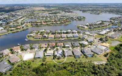 Aerial view of the Mirabay 136 acer lagoon.  Your home is located with in the circle.  Front door fa