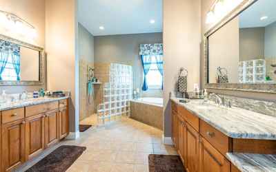 Master bath with separate vanities, garden tub, and walk in shower.