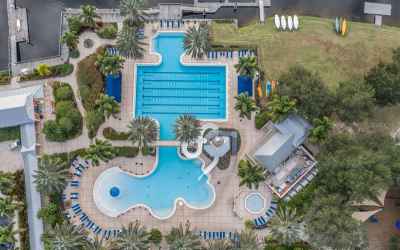 Family resort style zero entry pool with slide and play area, heated lap pool, quiet reflecting pool