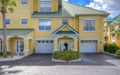 Featuring a tandem 3-car garage, 3-stories with an elevator, and overlooking a gorgeous lagoon!