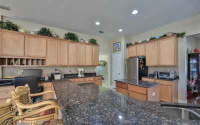 Granite counters with kitchen island. Cabinet storage galore, closet pantry and island storage. Sepe