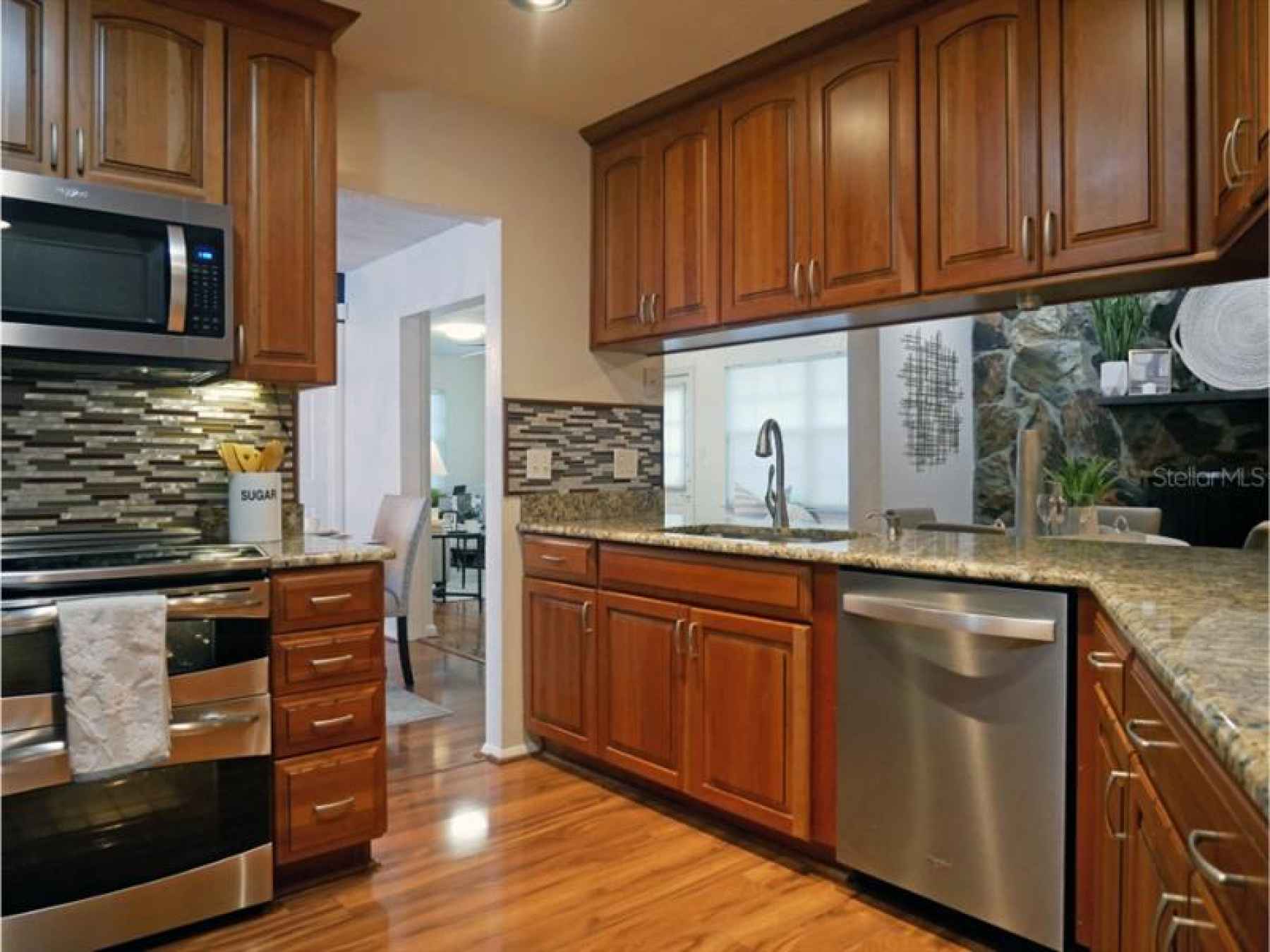 Kitchen, over looking the fireplace, higher end Stainless appliances, except the refrigerator