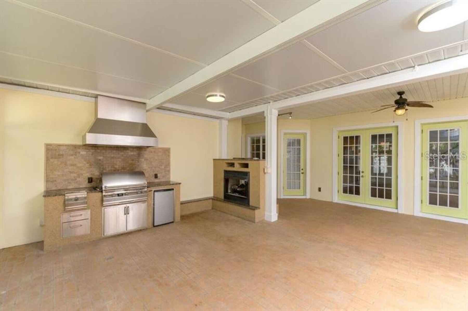 Florida/sun room with grill and gas double-sided fireplace