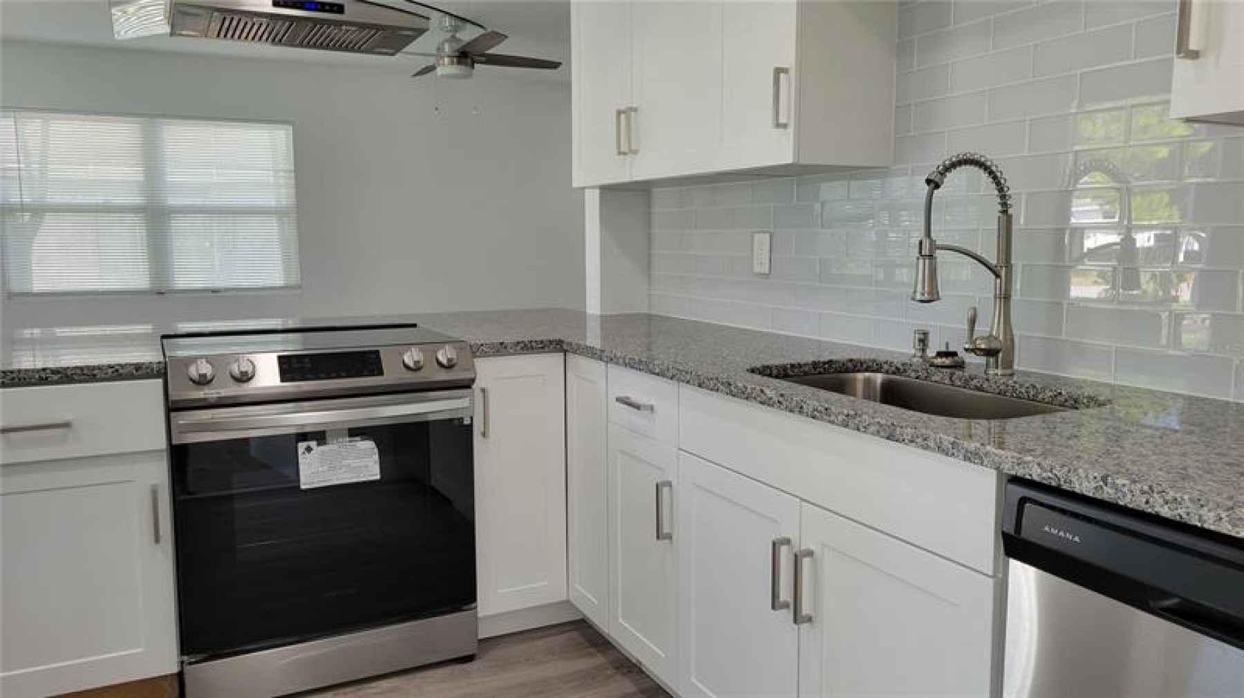 White Shaker cabinets with stainless steel appliances