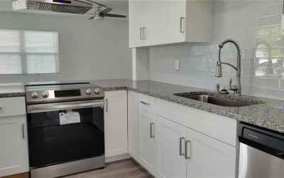 White Shaker cabinets with stainless steel appliances