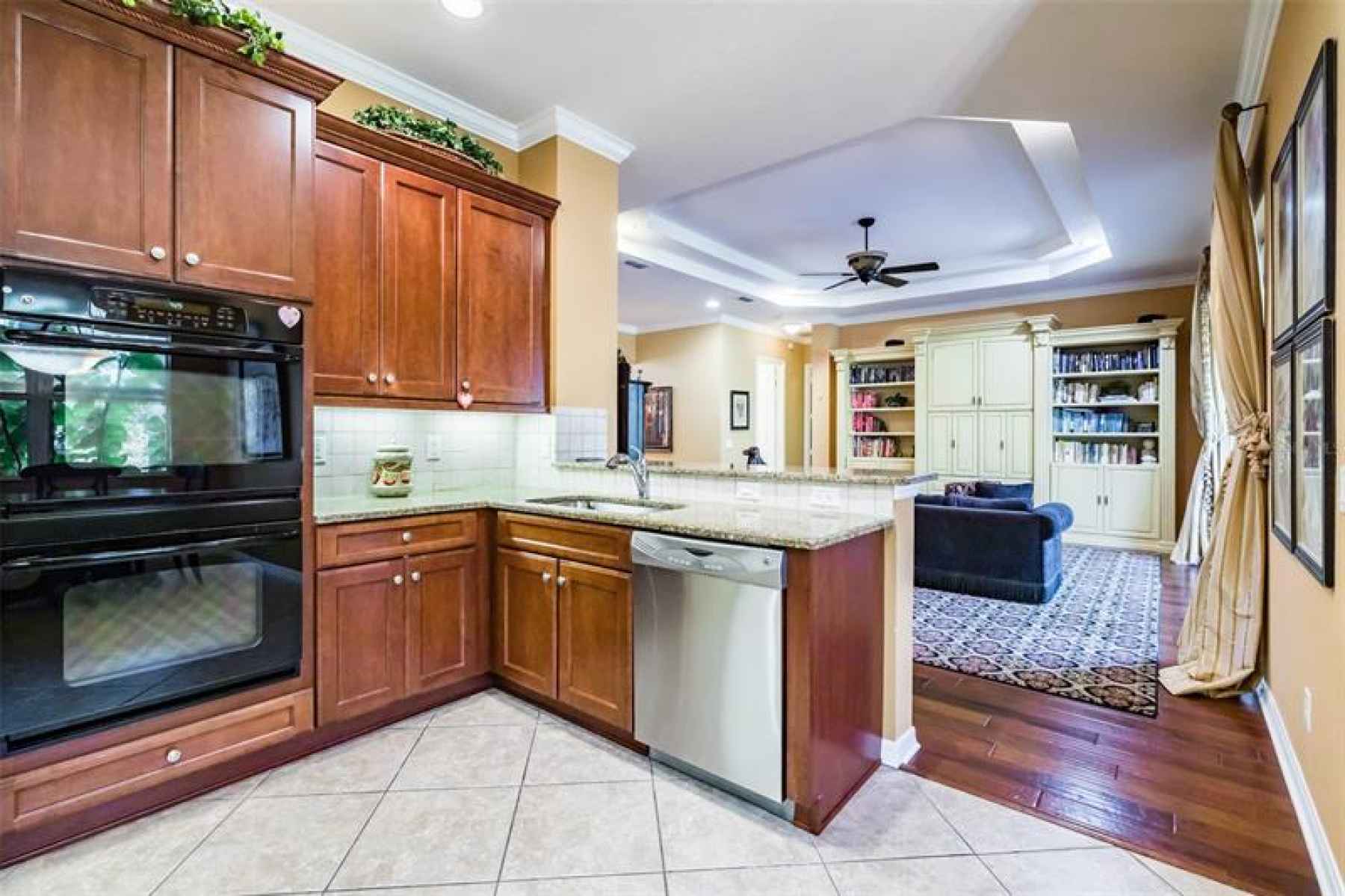 Kitchen features granite counters, solid maple cabinetry, double ovens, and a Pantry.