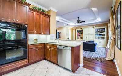 Kitchen features granite counters, solid maple cabinetry, double ovens, and a Pantry.