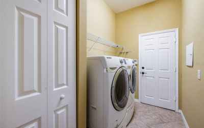 Laundry room leads to garage.