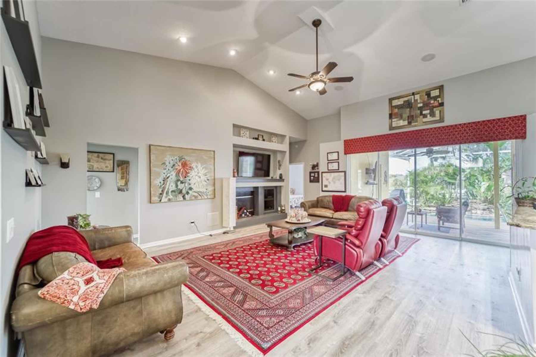 Great Room with High Cathedral Ceilings - Luxury Vinyl Flooring - Flush Mount Speakers - Fireplace