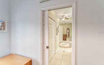 Entry to En-Suite with Pocket Door - His & Her Closets to Left and Right