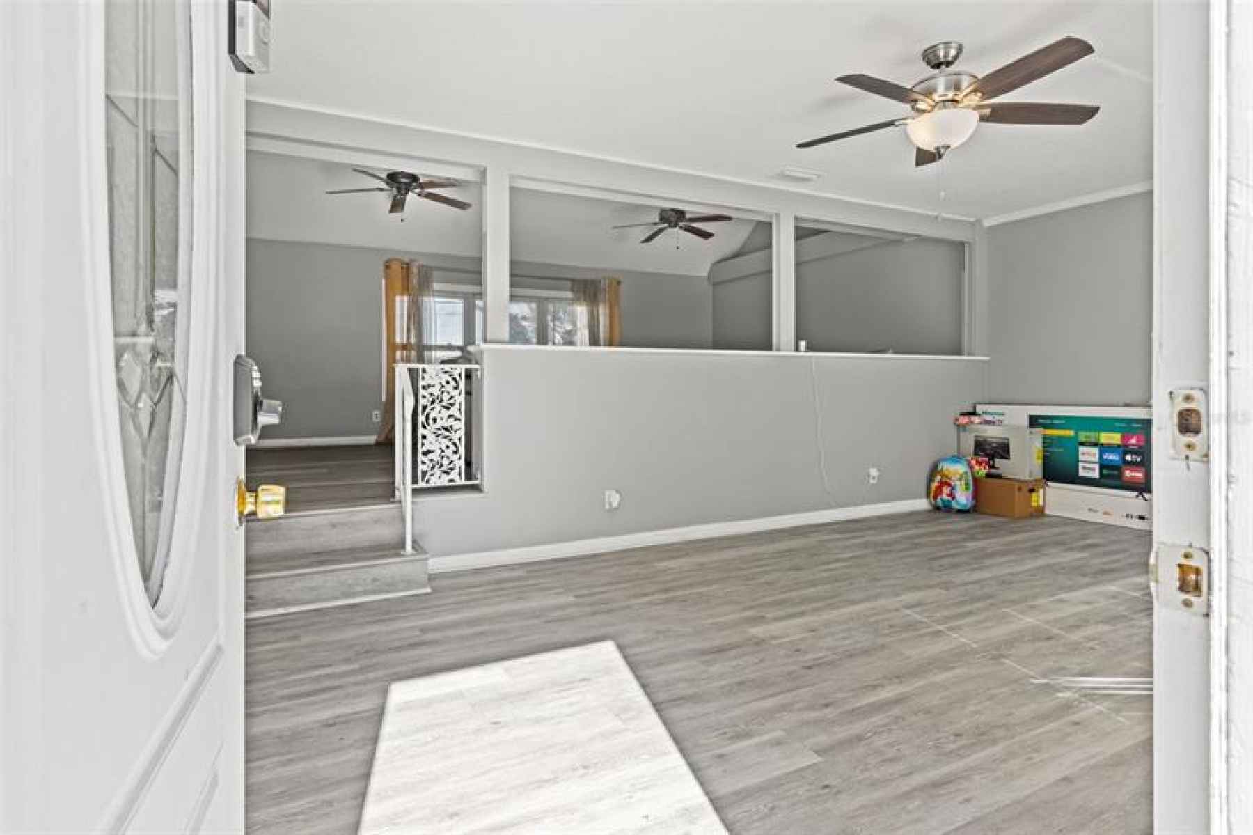 Enter the formal living room with ample space and lots of natural light!