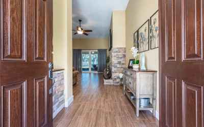Double door entry.  Notice the wood look tile and stone accents.