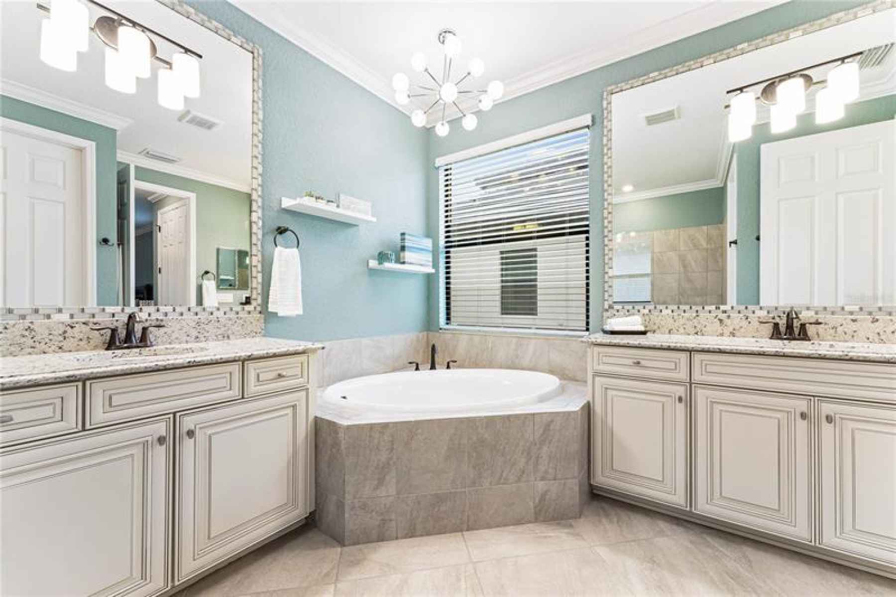 Master bathroom with large soaking tub and a double vanity.