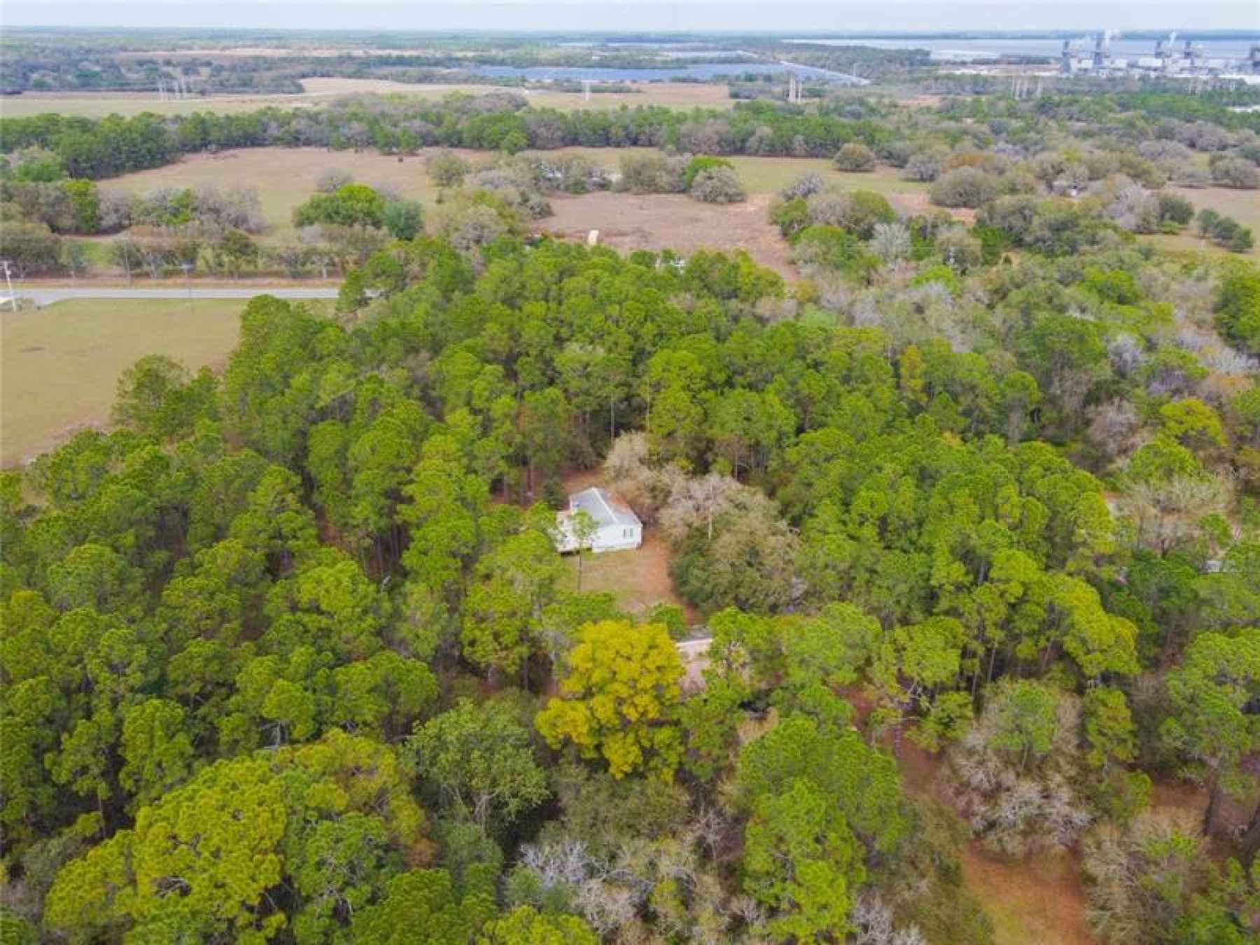 Welcome home to this country retreat with 10.46 acres in Parrish, yet close to all conveniences.