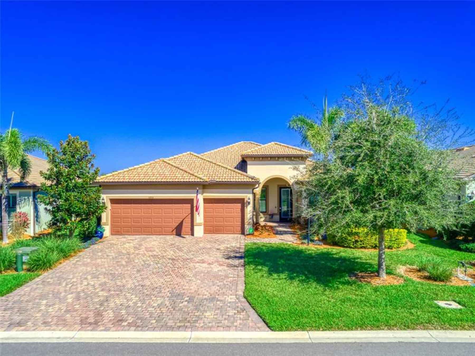 Upscale home with Paver Driveway & Tile Roof