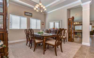 The formal dining room on the left offers a tray ceiling with crown!