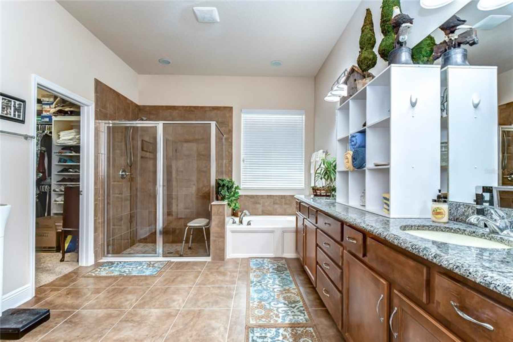 Featuring its own separate walk-in shower!