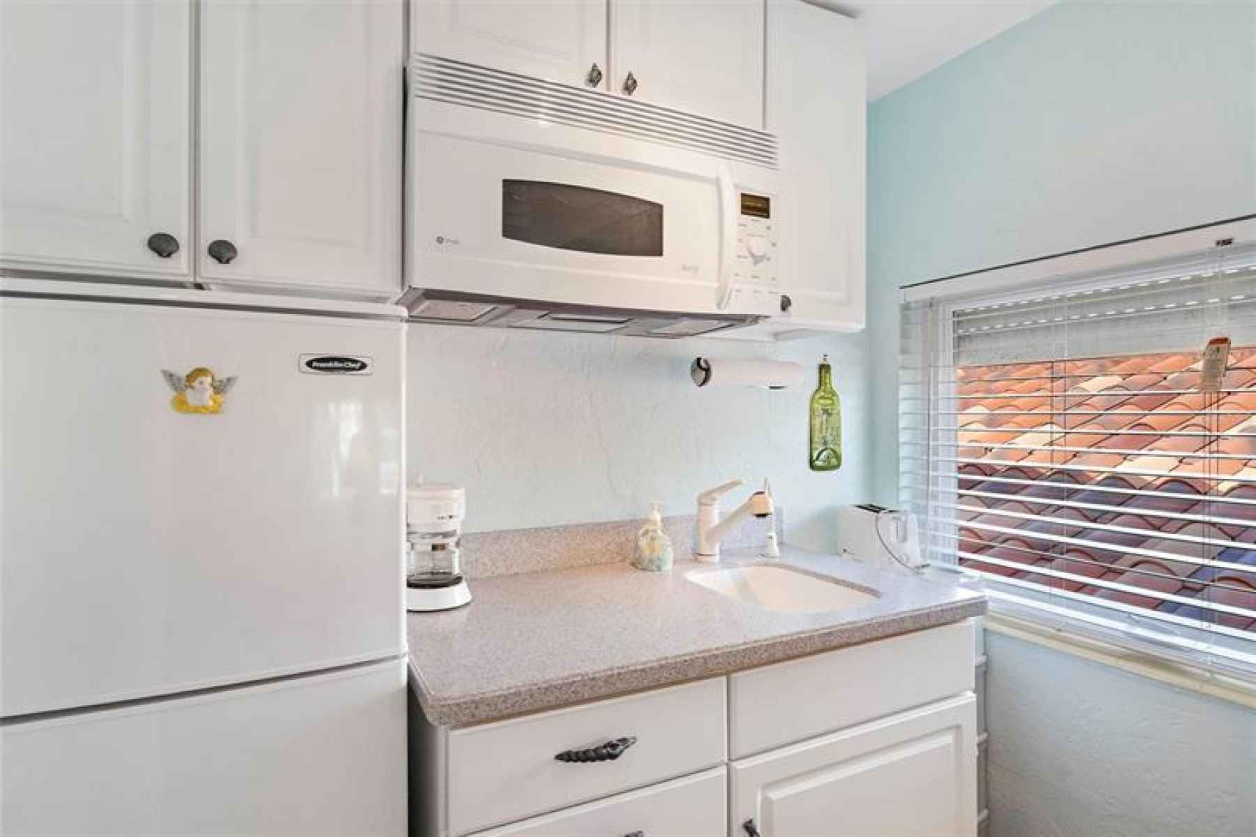 Apartment kitchenette with ample storage