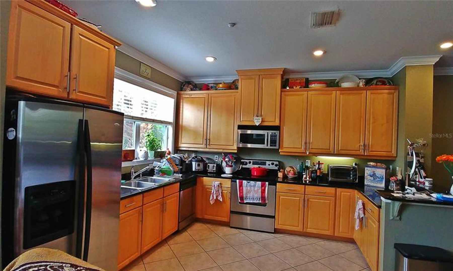 Large, fully-equipped kitchen with granite counter tops and stainless steel appliances