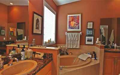 Master bath has dual sinks, separate tub and shower, and water closet