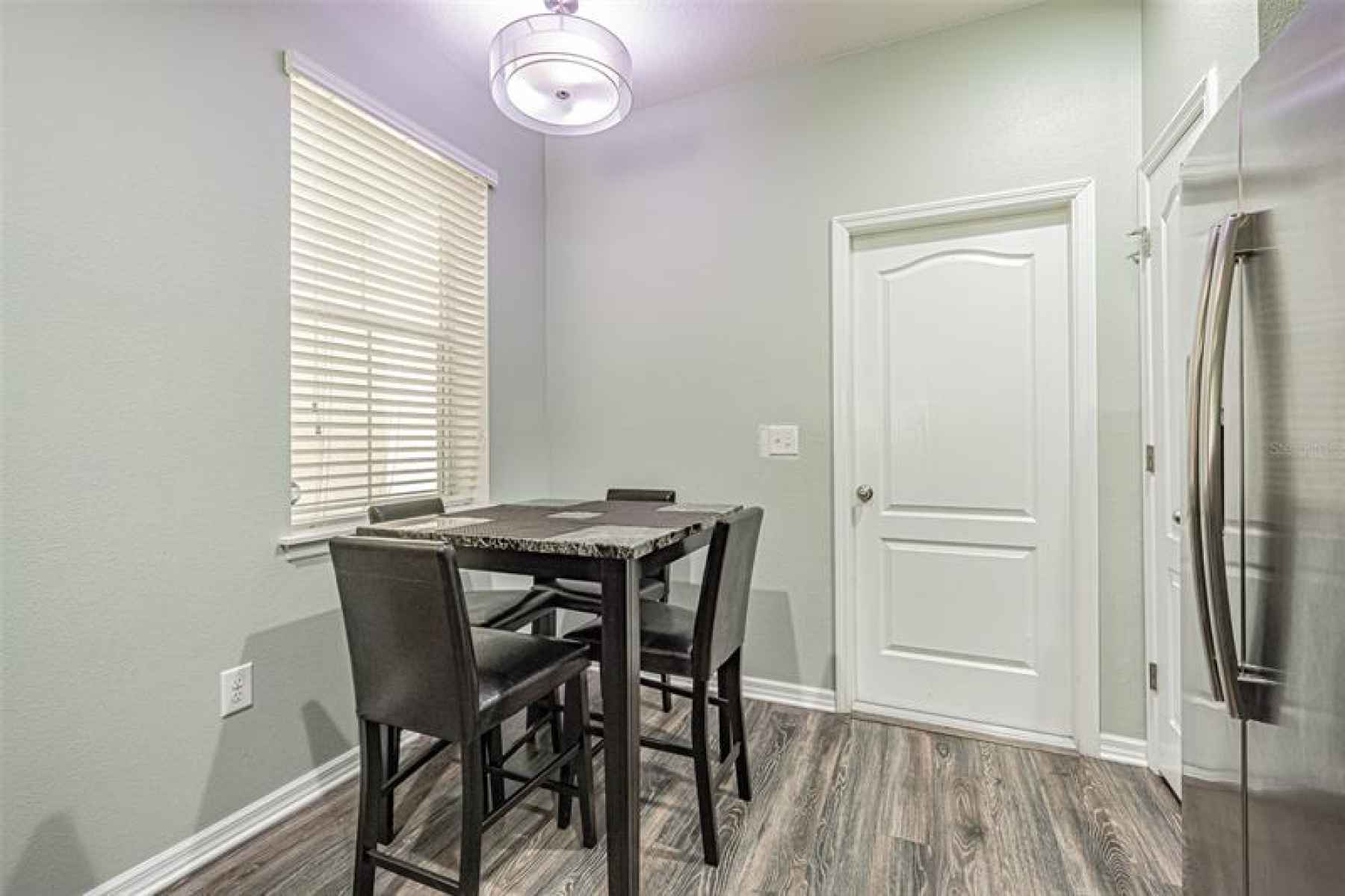 In connection to the garage entrance is a wonderful eat in kitchen with natural light.