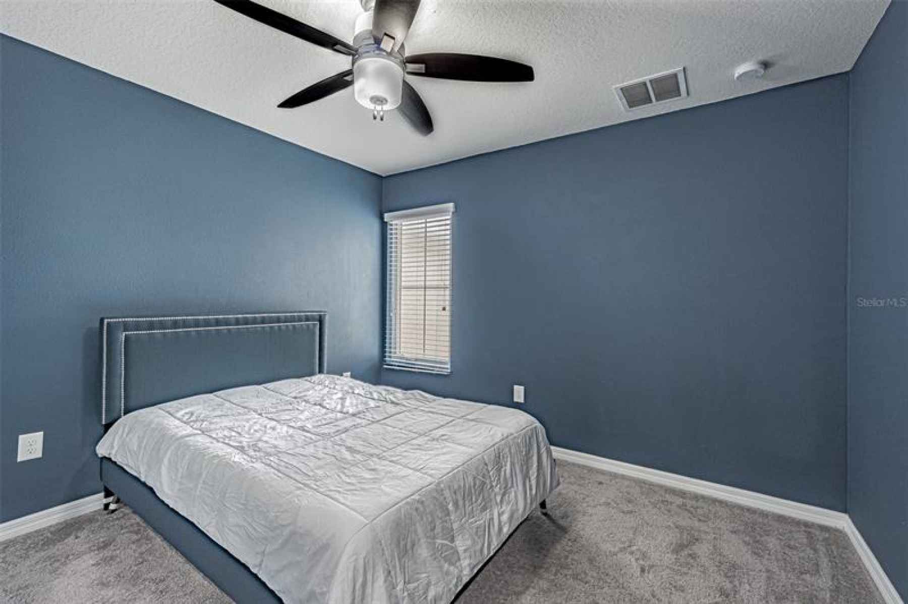 2 of 2 South facing bedrooms with ceiling fan