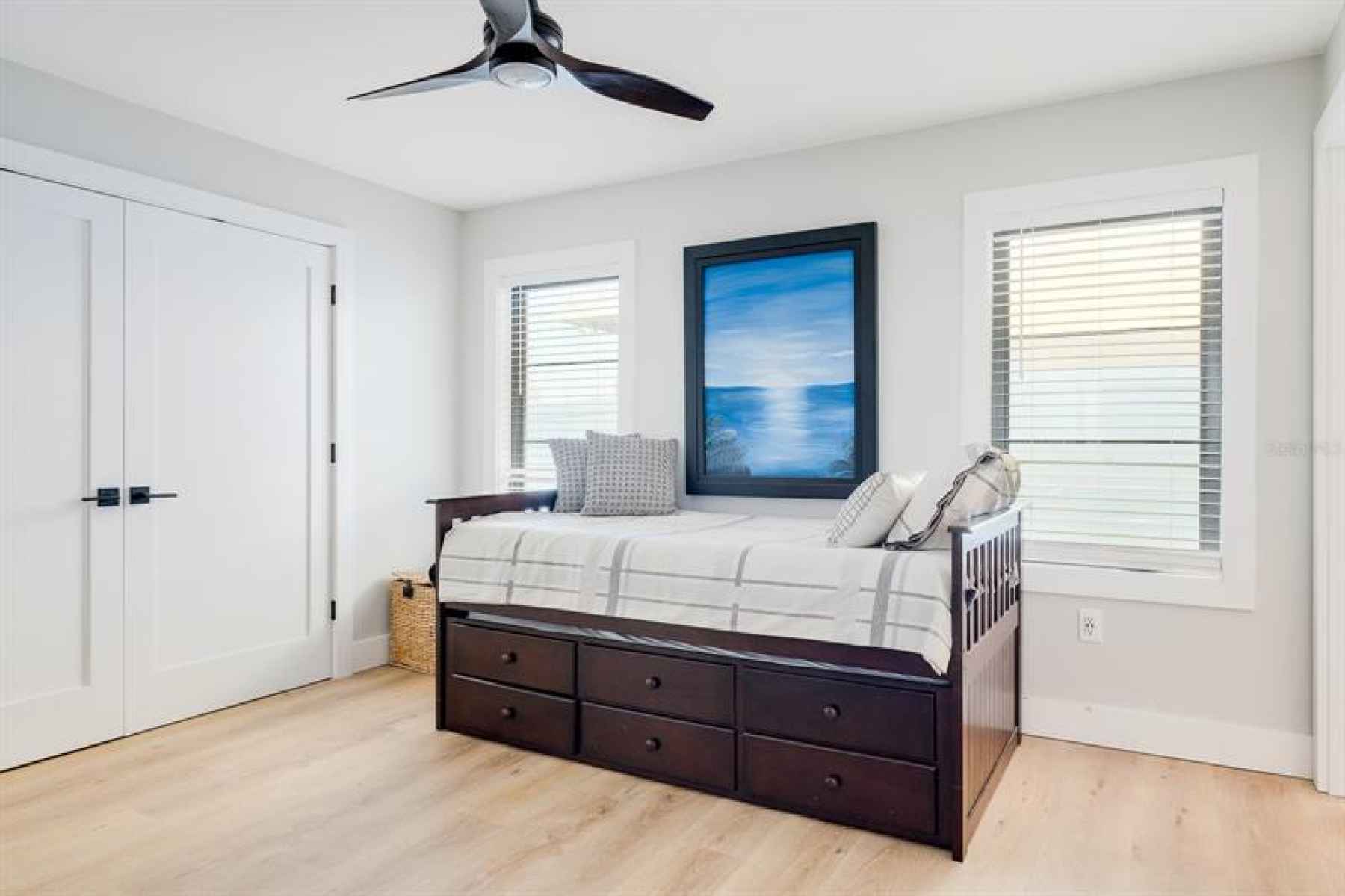 Guest Bedroom with double closets done by California Closets