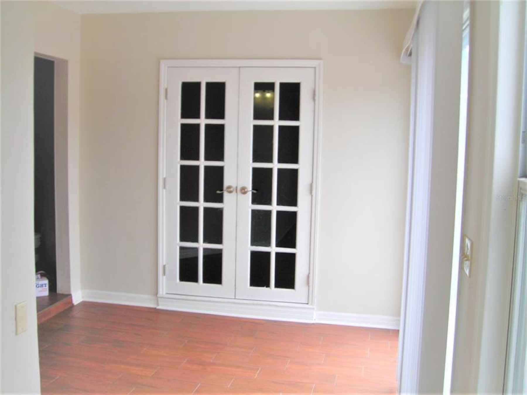 Other side of Florida Room with double door to Master bedroom