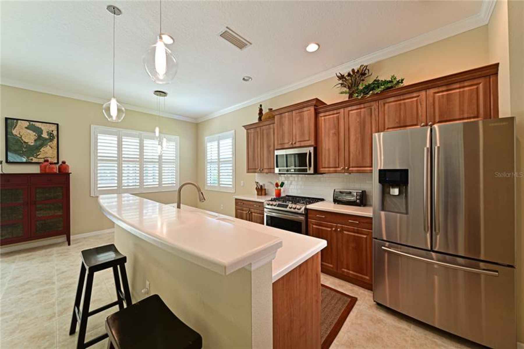 Kitchen features breakfast bar and Gas range with double oven!