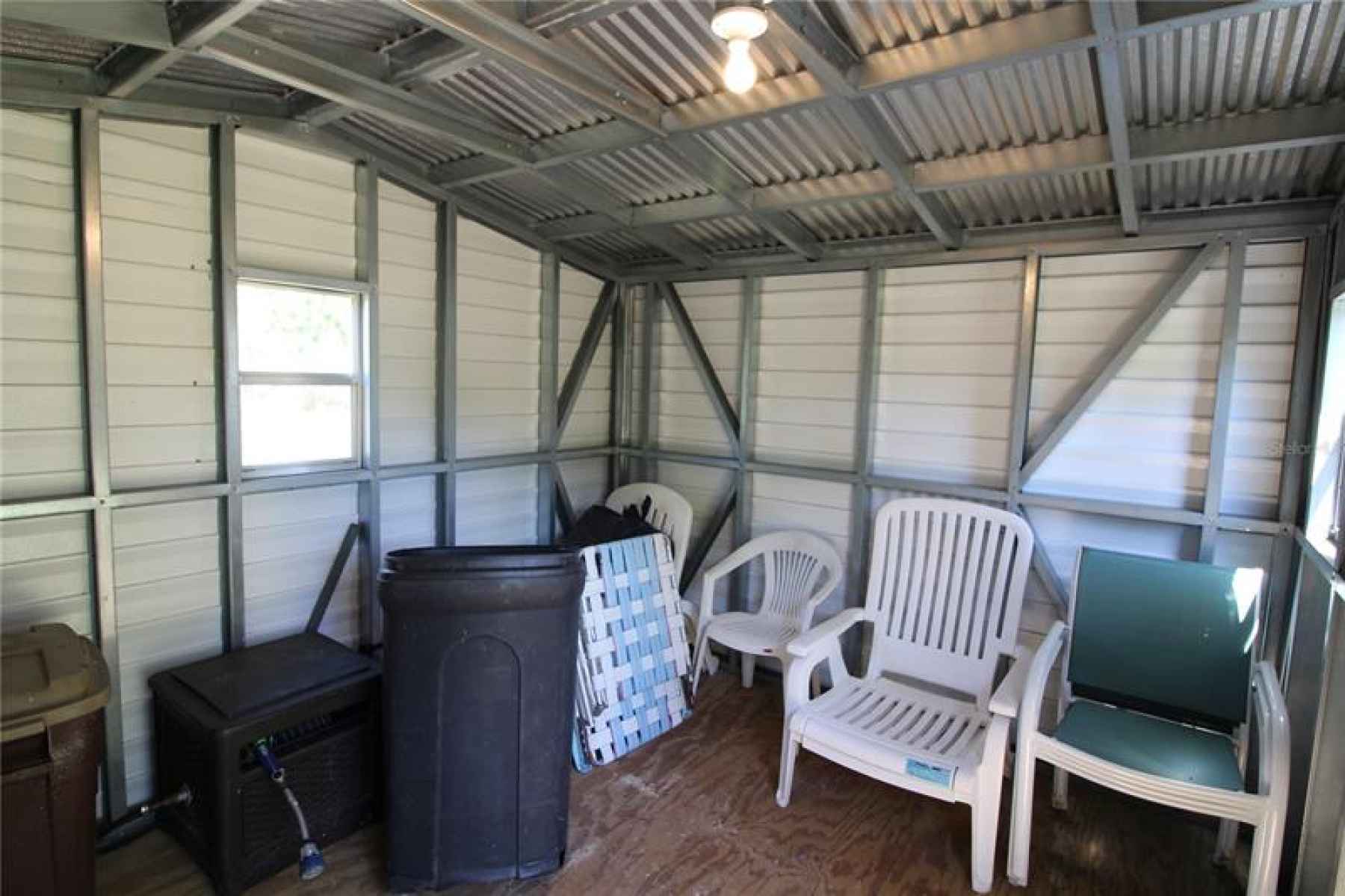 Shed has plenty of room for a riding mower and storage