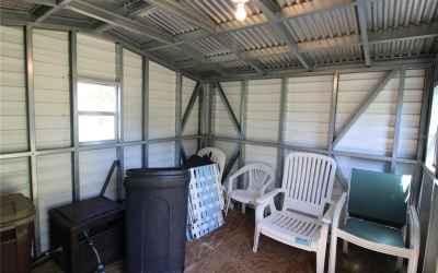 Shed has plenty of room for a riding mower and storage